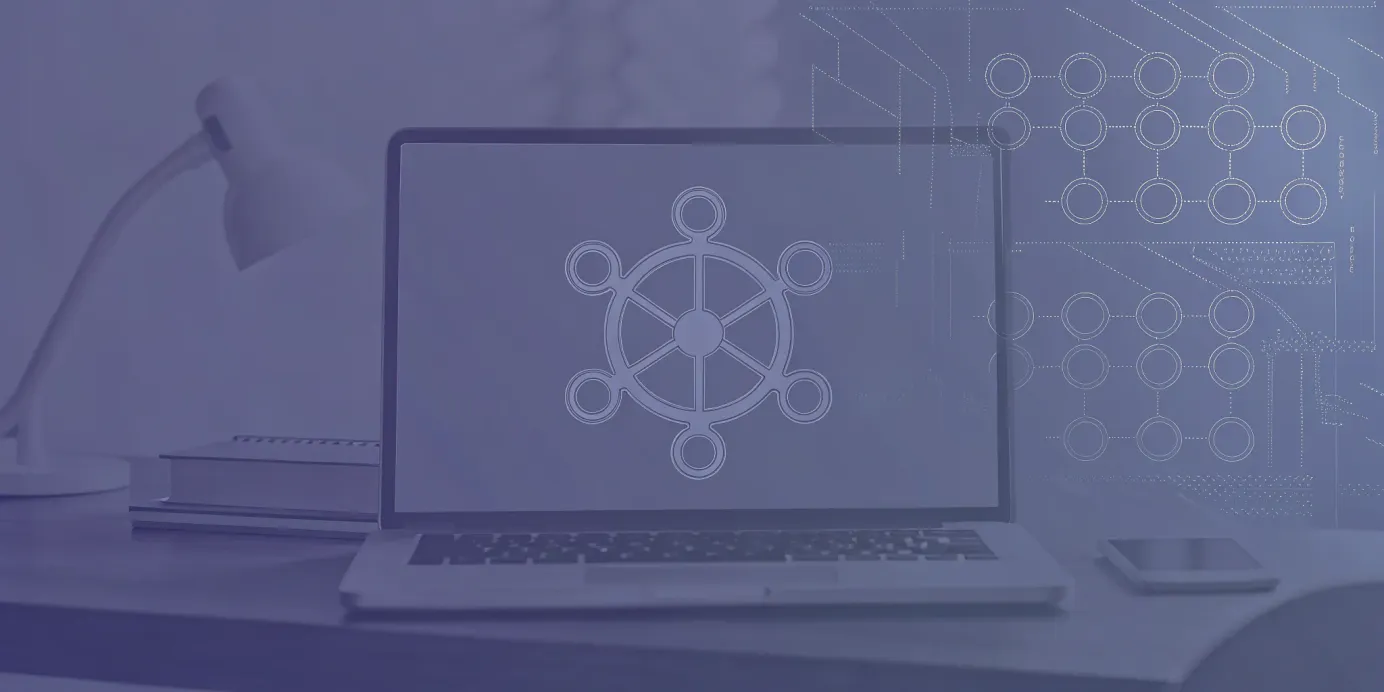 Laptop displaying the Kubernetes logo for a guide on continuous version updates.